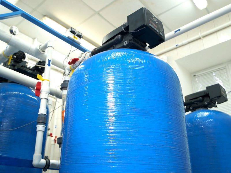 Water filters at the plant. Tanks and pipes. Renewed equipment at factory. Modern technologies of water purification.